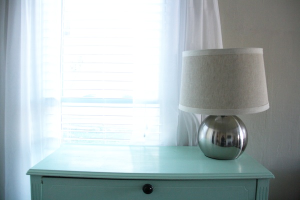 Lamp on blue dresser.